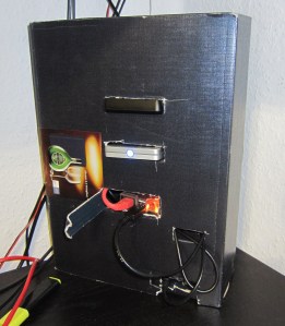 Made from a shoe box. Contains a pi, two usb disk, powered usb switch and a 1000 MBit/s ethernet switch.